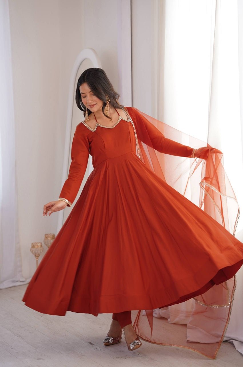 Rust Orange Roman Silk Chanderi Anarkali Suit with 4+ Meter Flair Rust Orange Roman Silk Chanderi Anarkali Suit with 4+ Meter Flair