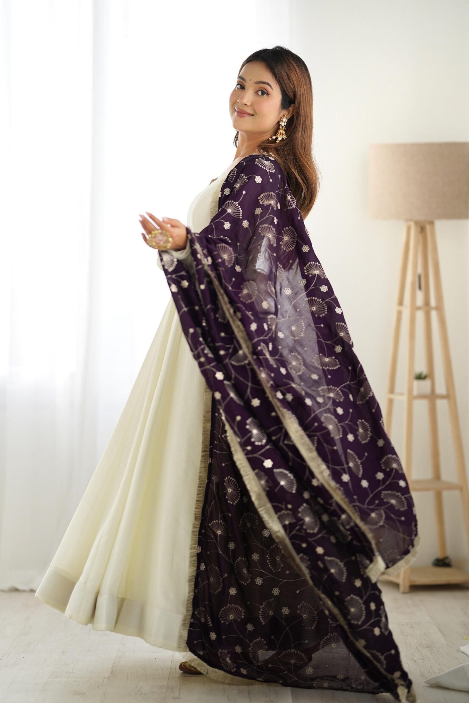 White Silk Anarkali Gown with Purple Heavy Embroidered Dupatta White Silk Anarkali Gown with Purple Heavy Embroidered Dupatta