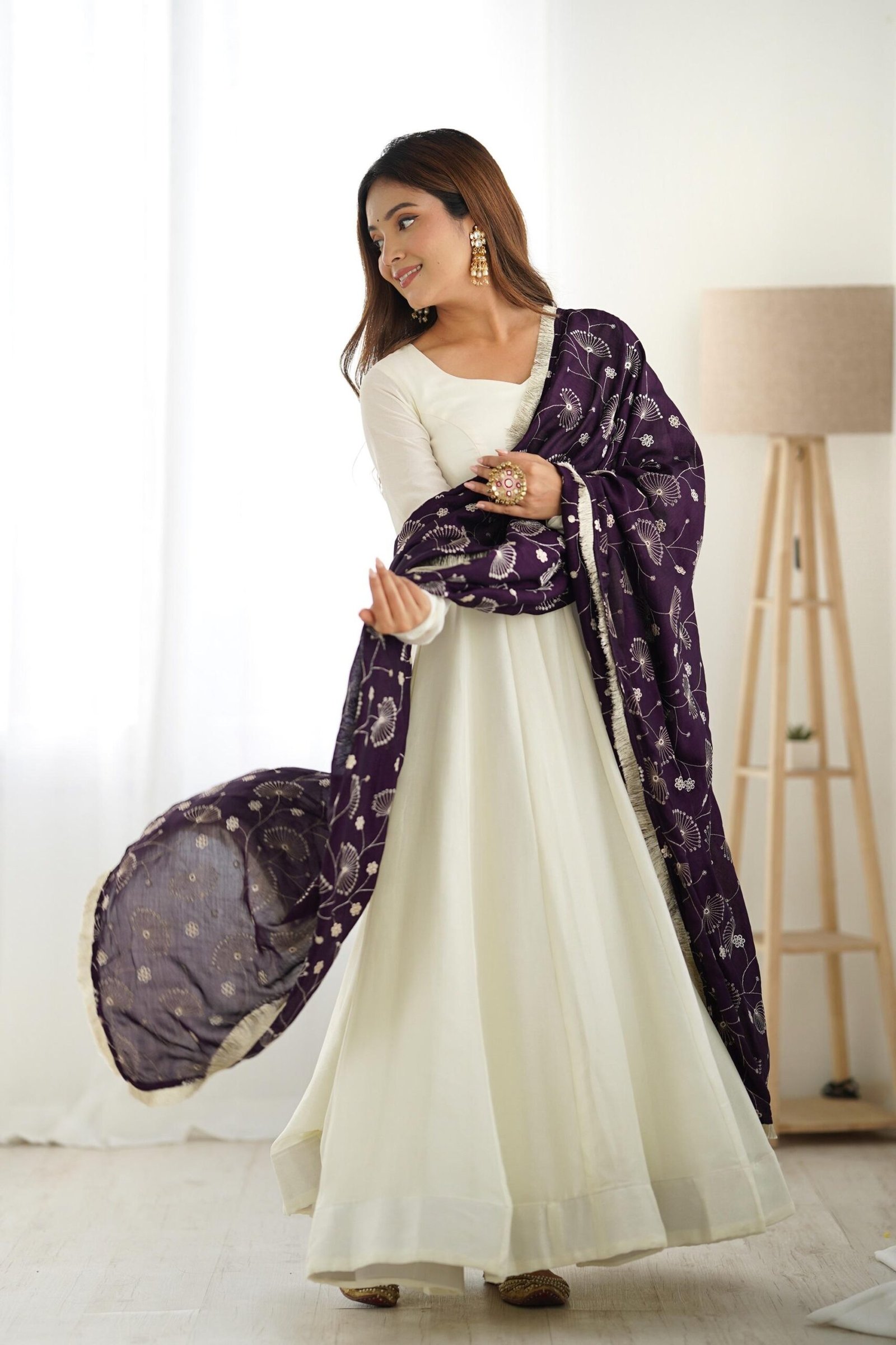 White Silk Anarkali Gown with Purple Heavy Embroidered Dupatta White Silk Anarkali Gown with Purple Heavy Embroidered Dupatta
