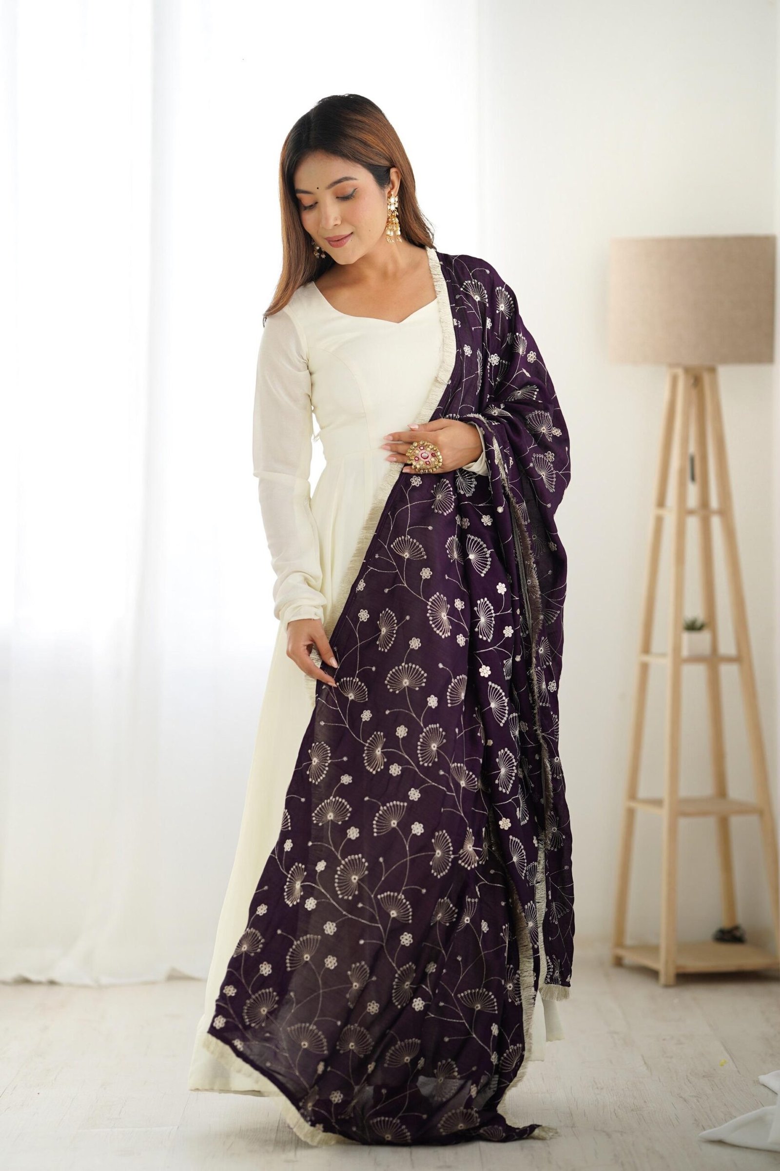 White Silk Anarkali Gown with Purple Heavy Embroidered Dupatta White Silk Anarkali Gown with Purple Heavy Embroidered Dupatta